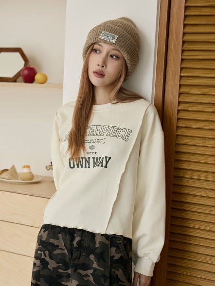 小翅膀捲邊拼接長袖上衣